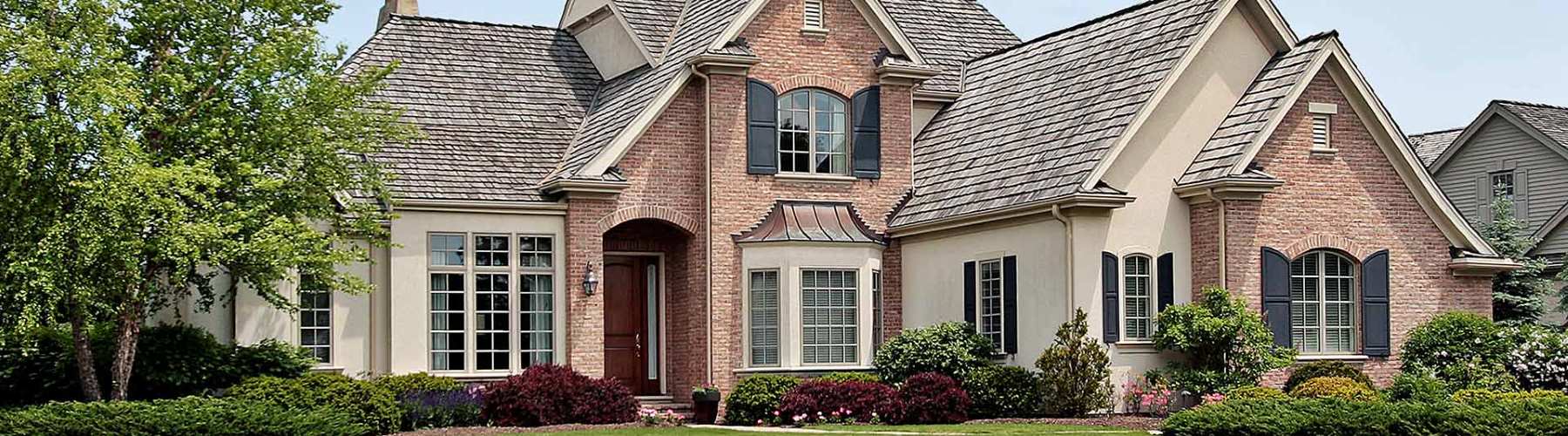 Home insurance represented by view of front of a house from the street